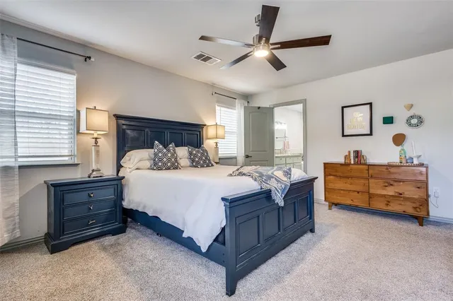 a bed room with a bed and a dresser