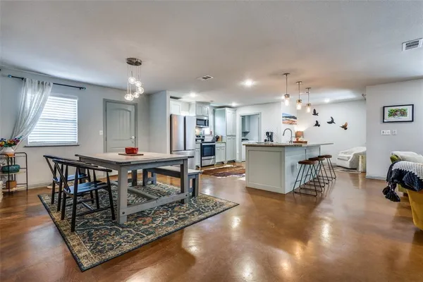 a view of a dining room with furniture
