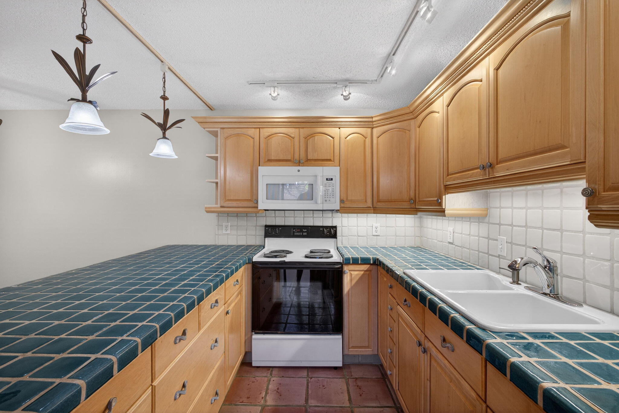 825 Center Street, Unit 50A Jupiter, FL 33458 - Photo 11 of 53 a kitchen with a sink stove and cabinets