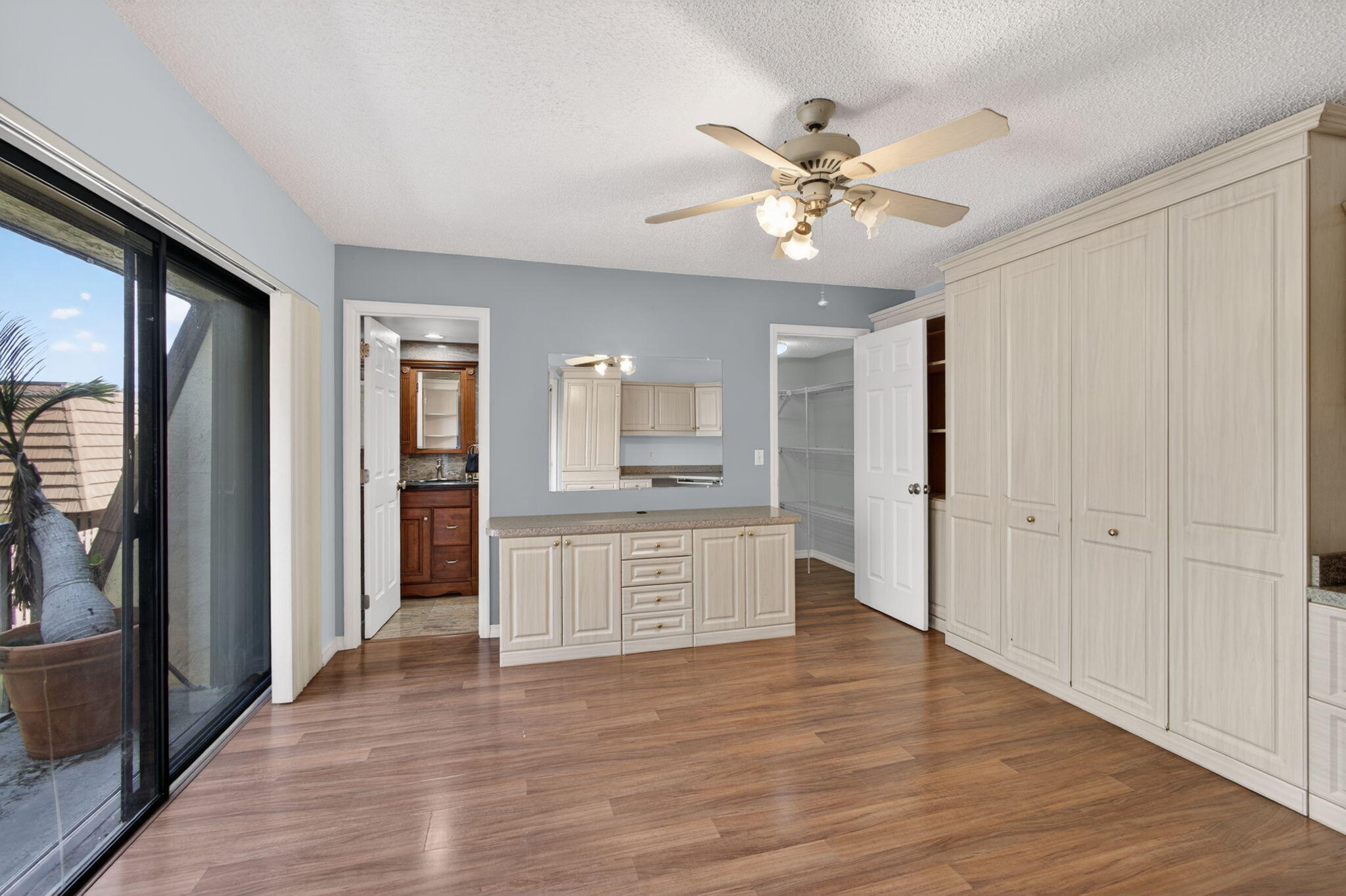 825 Center Street, Unit 50A Jupiter, FL 33458 - Photo 15 of 53 a view of an empty room with window and wooden floor