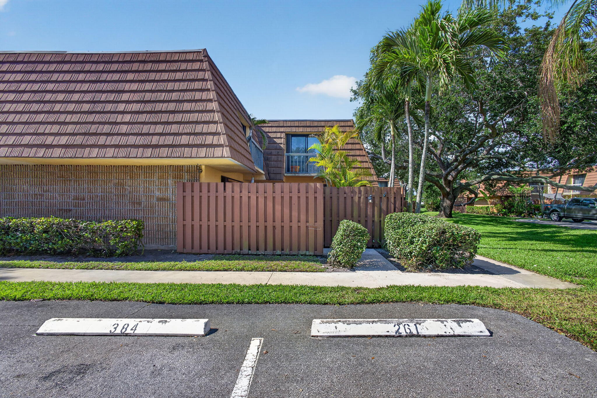825 Center Street, Unit 50A Jupiter, FL 33458 - Photo 2 of 53 a view of backyard with a garden and deck