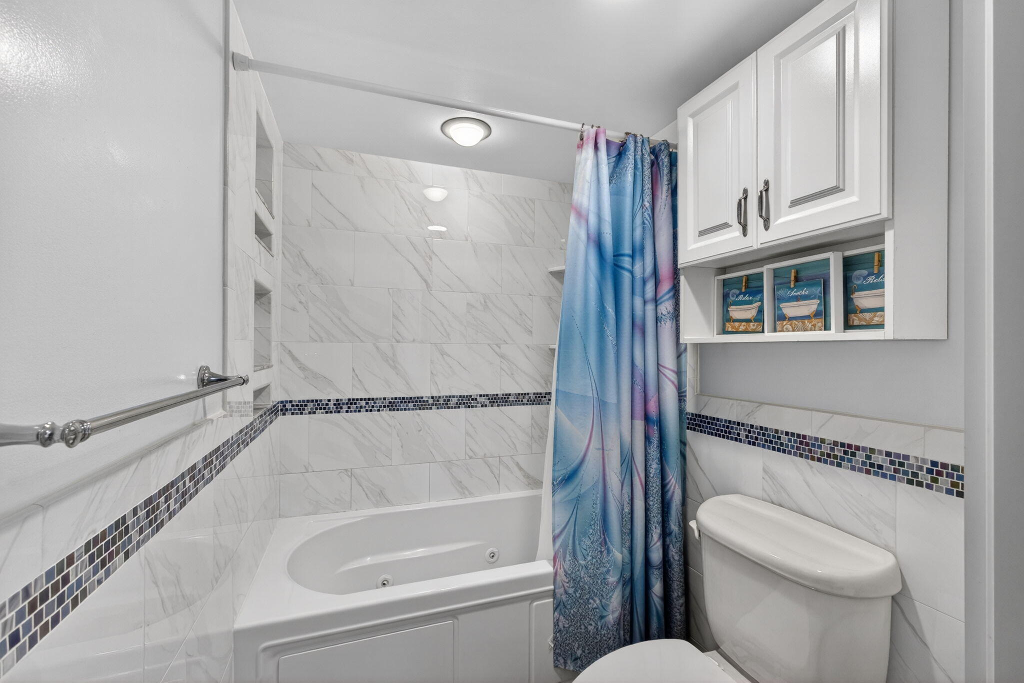 825 Center Street, Unit 50A Jupiter, FL 33458 - Photo 24 of 53 a bathroom with a granite countertop bathtub shower sink mirror and toilet