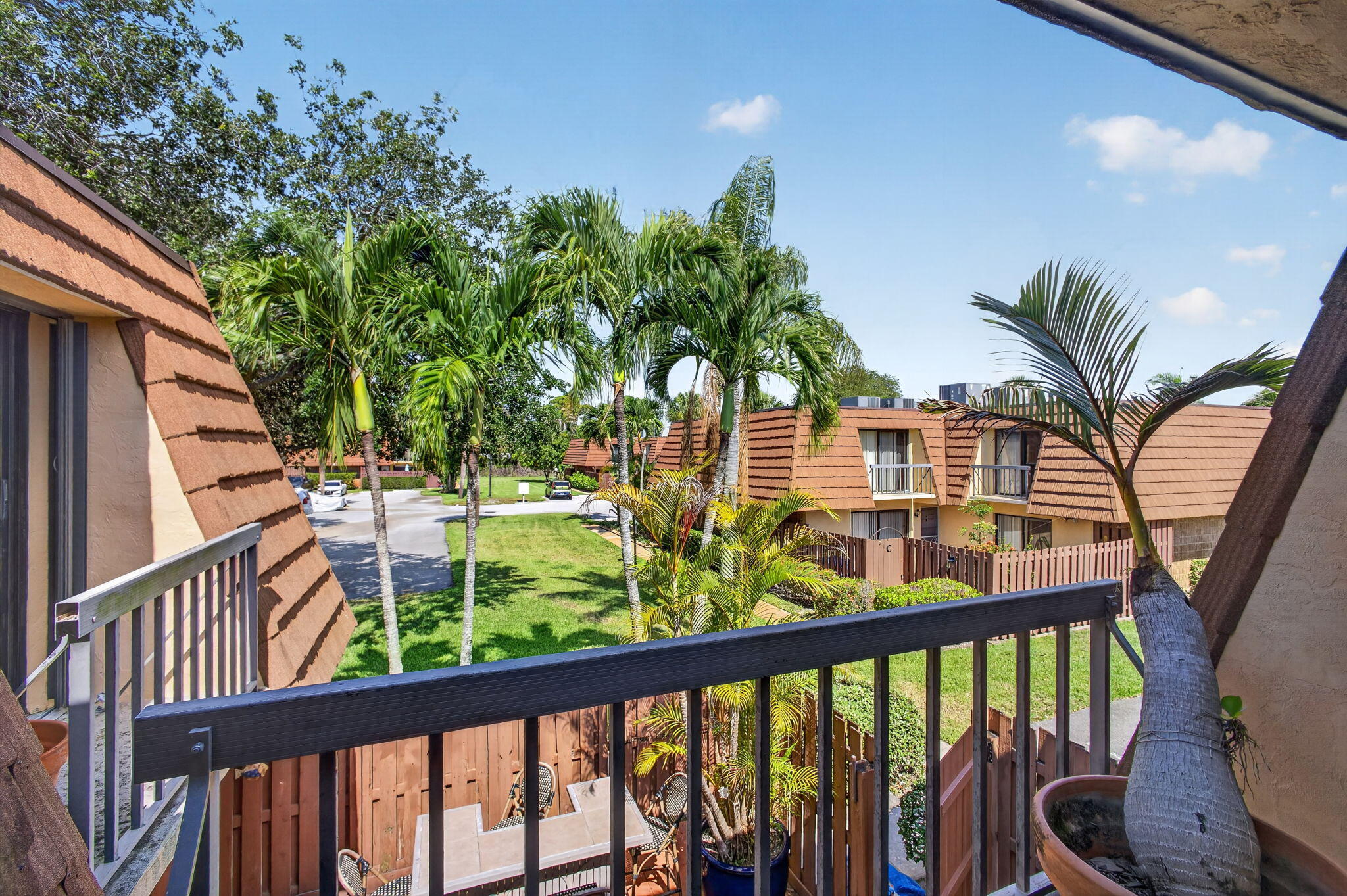 825 Center Street, Unit 50A Jupiter, FL 33458 - Photo 25 of 53 a view of a balcony with wooden floor and outdoor space