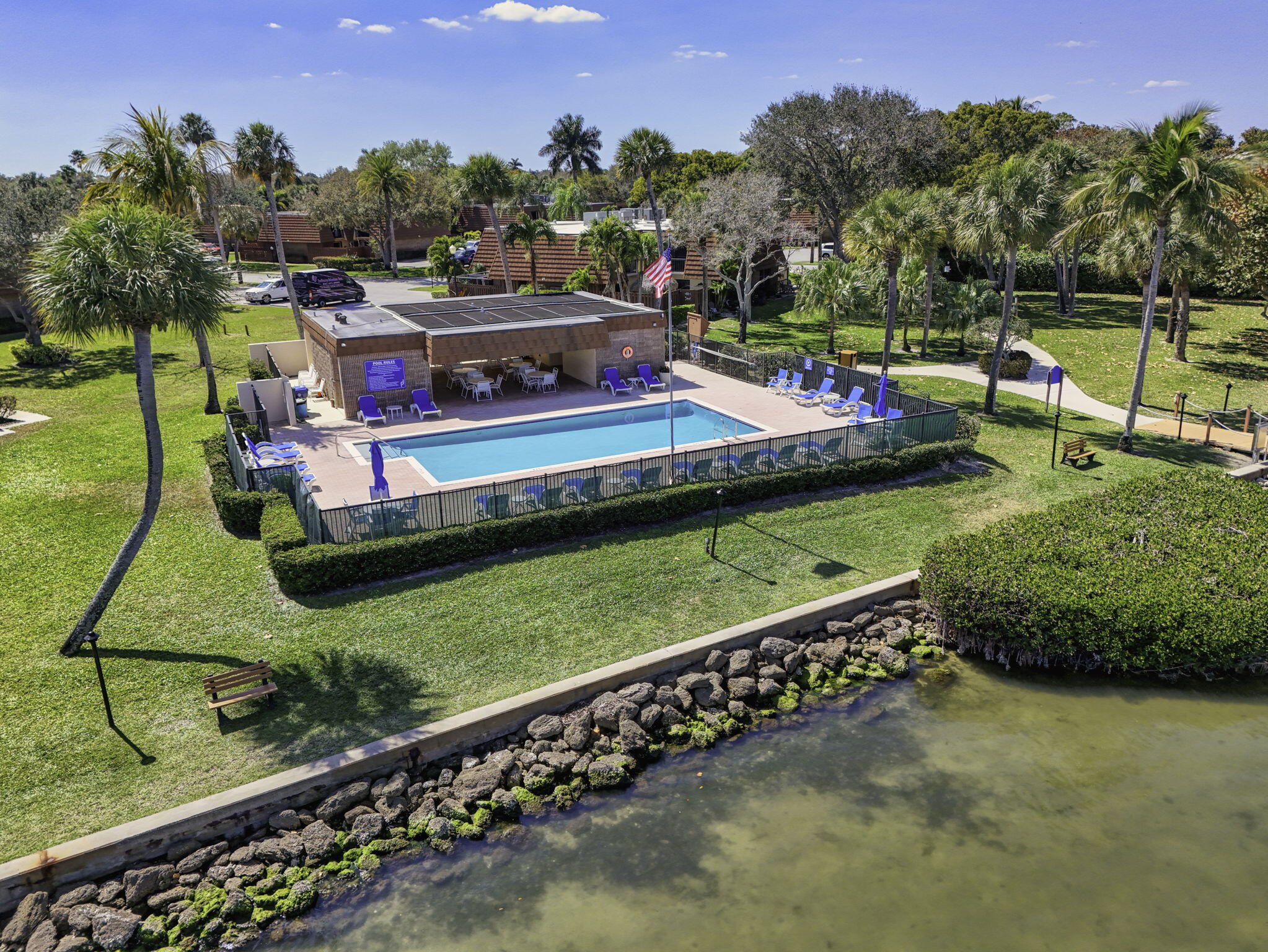 825 Center Street, Unit 50A Jupiter, FL 33458 - Photo 30 of 53 an aerial view of a house with a yard swimming pool and outdoor seating