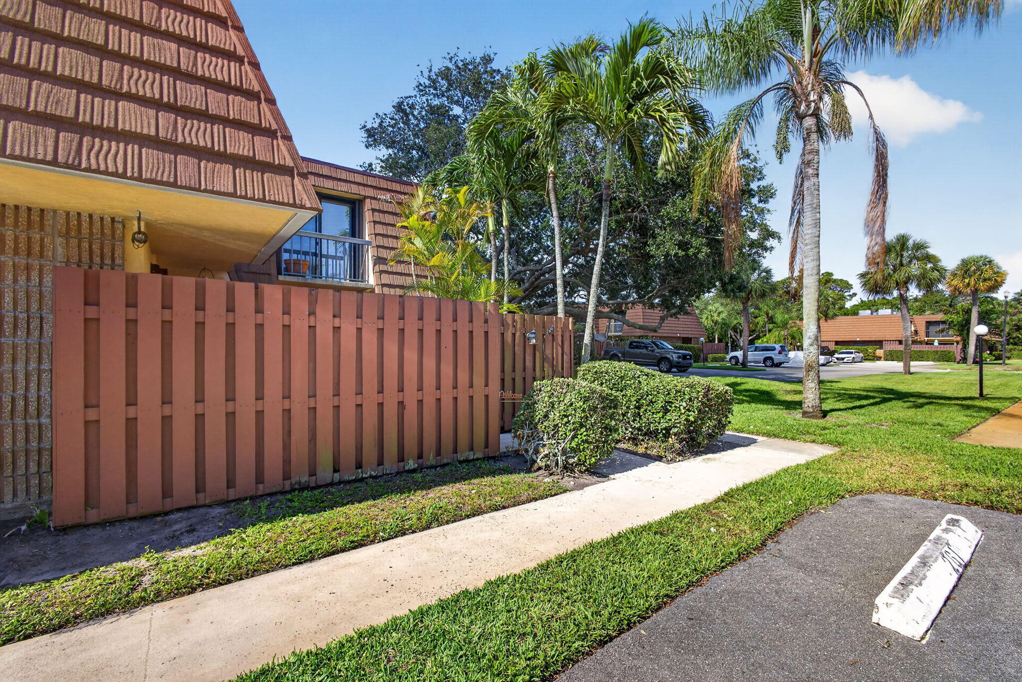 825 Center Street, Unit 50A Jupiter, FL 33458 - Photo 3 of 53 a view of a house with a yard and plants