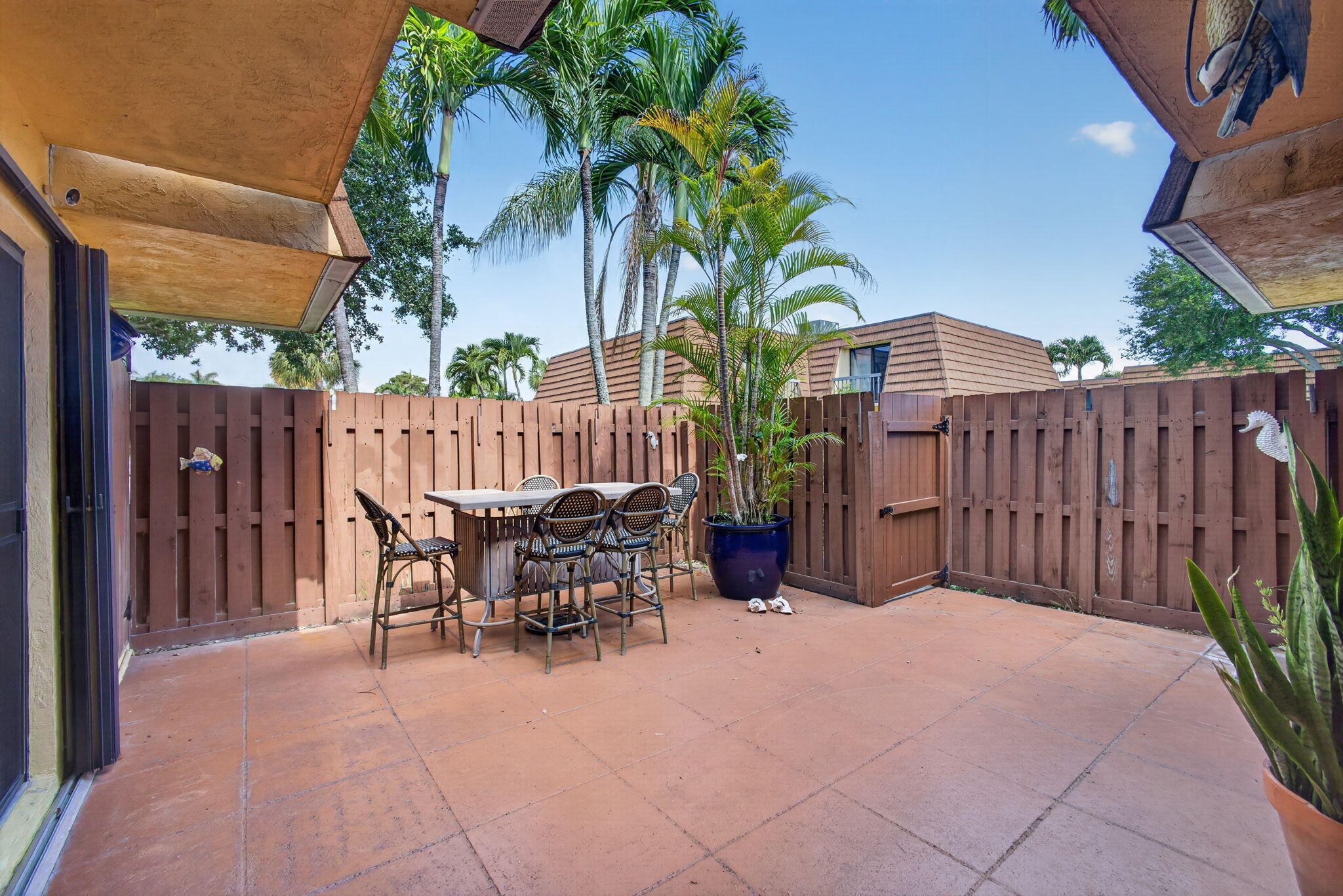 825 Center Street, Unit 50A Jupiter, FL 33458 - Photo 4 of 53 a view of a dinning table and chairs in patio
