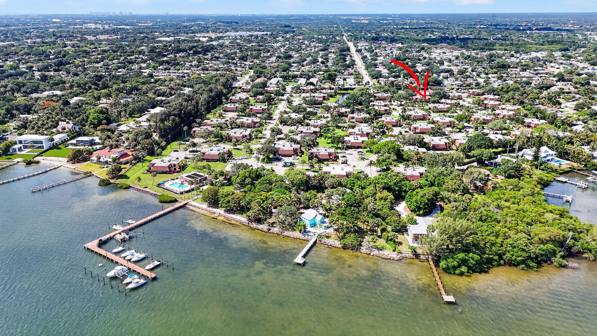 825 Center Street, Unit 50A Jupiter, FL 33458 - Photo 53 of 53 an aerial view of a residential houses with street and trees