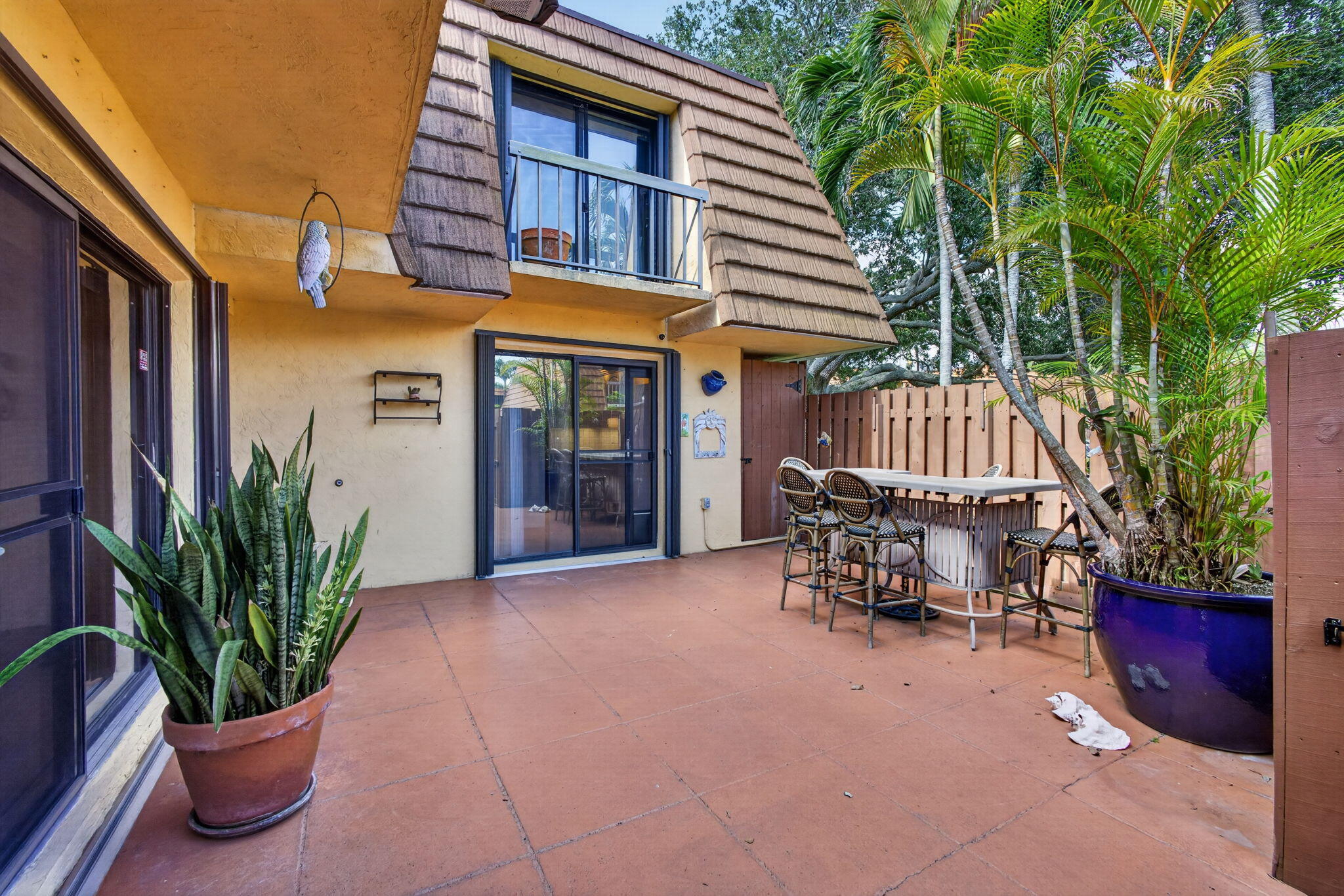 825 Center Street, Unit 50A Jupiter, FL 33458 - Photo 6 of 53 a view of a house with a patio and a yard
