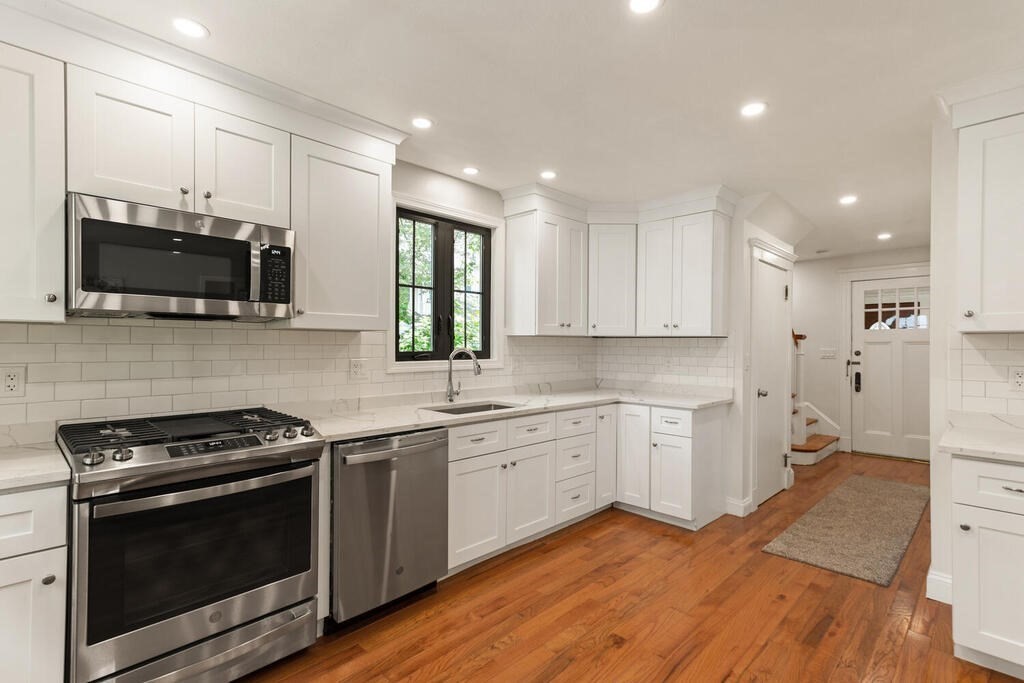58 Maple Road Melrose, MA 02176 - Photo 12 of 34 a kitchen with a sink stove and microwave