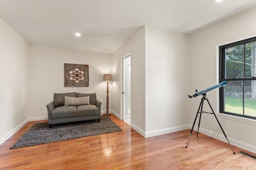 58 Maple Road Melrose, MA 02176 - Photo 16 of 34 a living room with furniture and a wooden floor