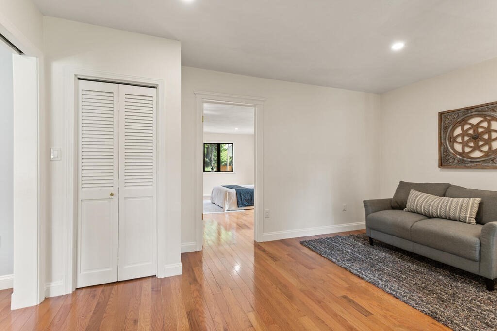 58 Maple Road Melrose, MA 02176 - Photo 17 of 34 a living room with furniture and a wooden floor