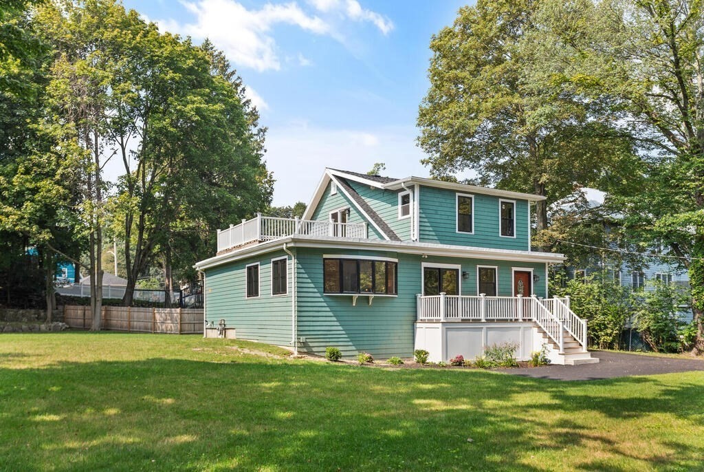 58 Maple Road Melrose, MA 02176 - Photo 2 of 34 a view of a house with a yard deck and a small cabin
