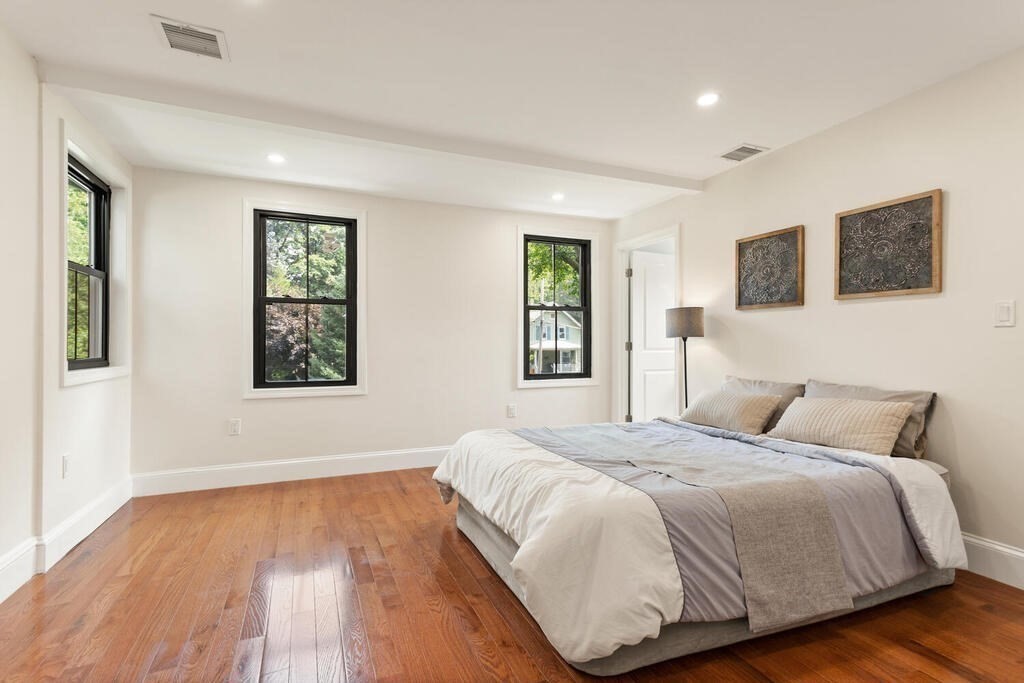 58 Maple Road Melrose, MA 02176 - Photo 21 of 34 a bedroom with a large bed and a window