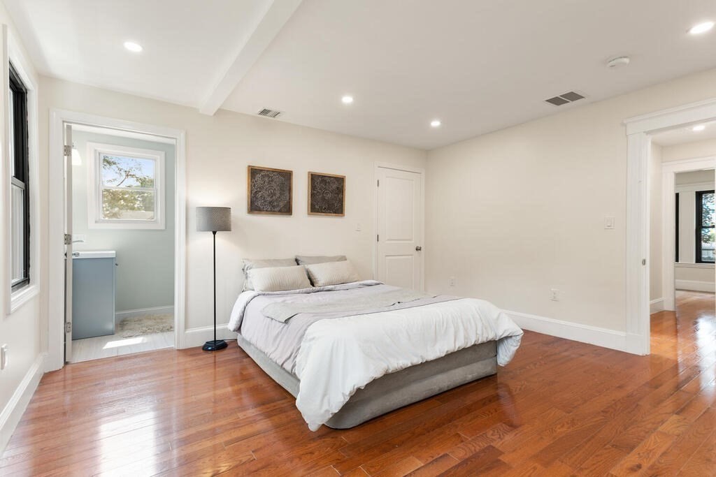 58 Maple Road Melrose, MA 02176 - Photo 22 of 34 a bedroom with a bed and a view of bathroom