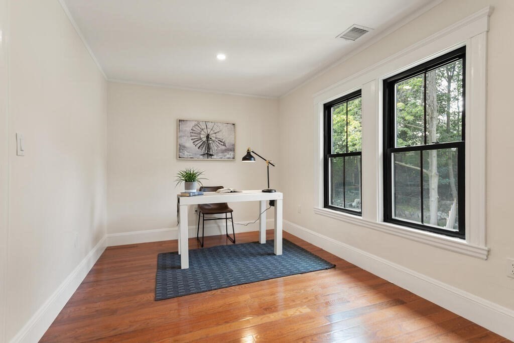 58 Maple Road Melrose, MA 02176 - Photo 24 of 34 a view of a work space with wooden floor and a window