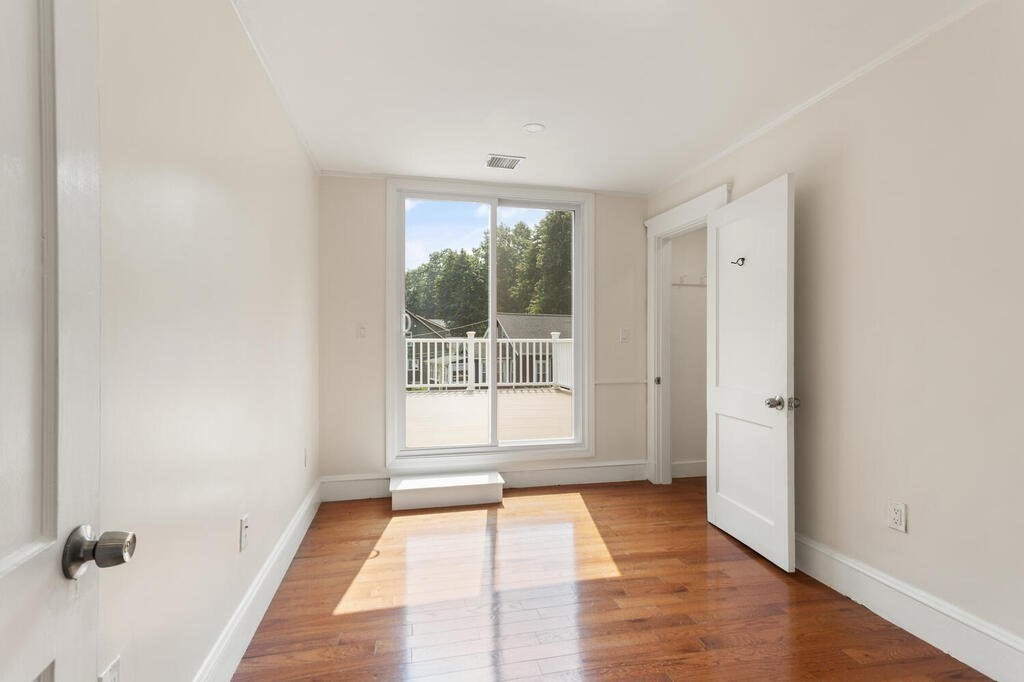 58 Maple Road Melrose, MA 02176 - Photo 26 of 34 a view of an empty room with a window
