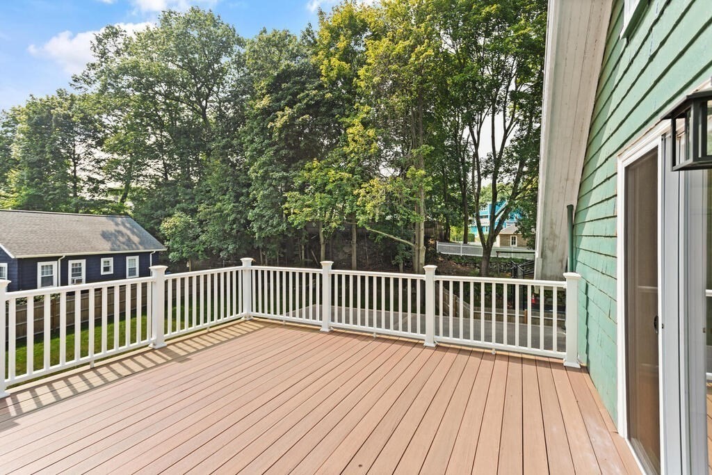 58 Maple Road Melrose, MA 02176 - Photo 30 of 34 a view of backyard with deck and wooden floor
