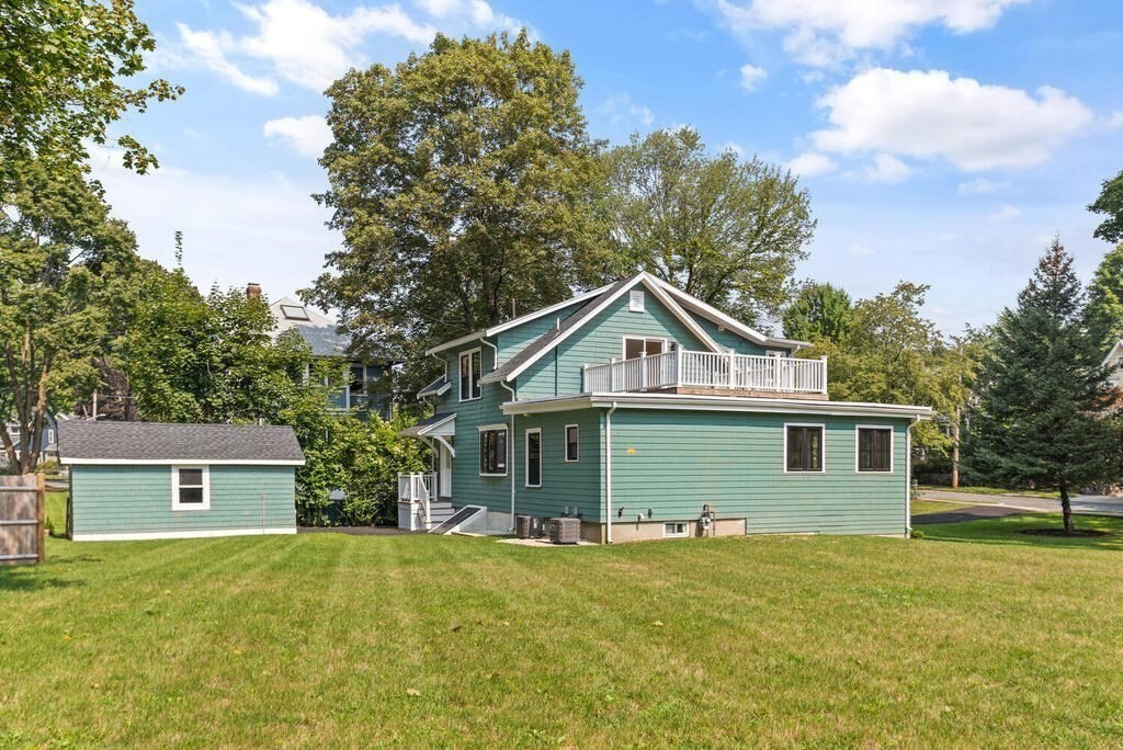 58 Maple Road Melrose, MA 02176 - Photo 31 of 34 a front view of a house with a garden