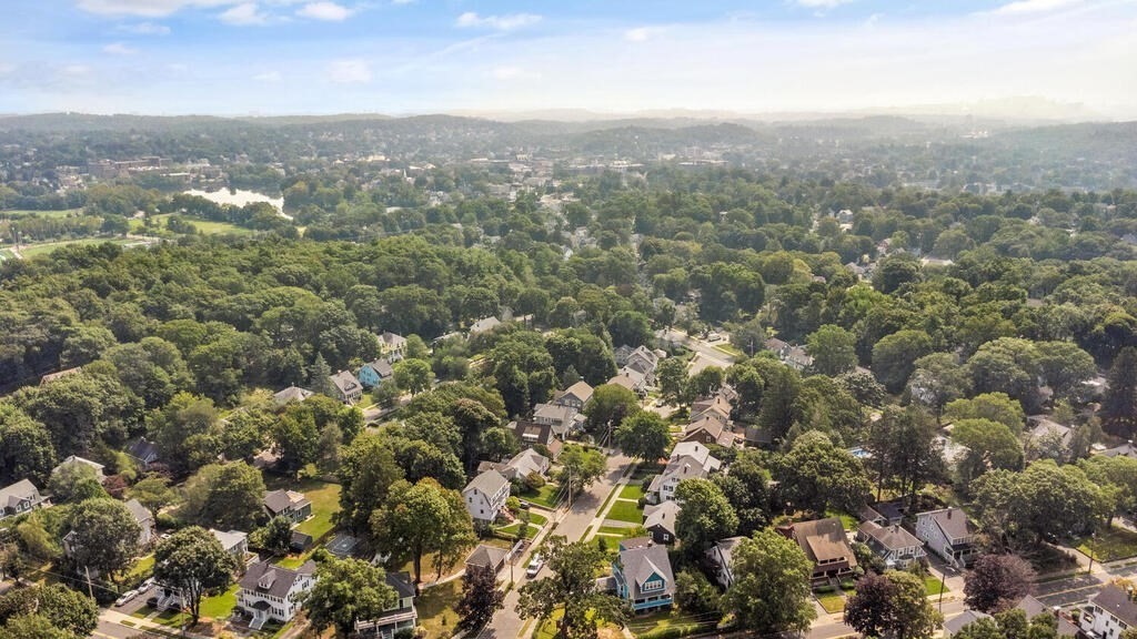 58 Maple Road Melrose, MA 02176 - Photo 34 of 34 an aerial view of houses covered in trees