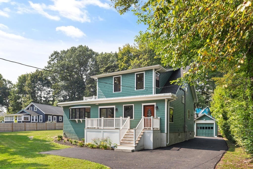 58 Maple Road Melrose, MA 02176 - Photo 4 of 34 a front view of a house with a yard