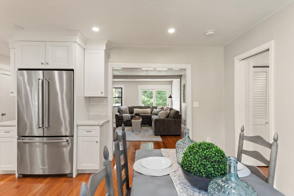 58 Maple Road Melrose, MA 02176 - Photo 9 of 34 a kitchen with stainless steel appliances a refrigerator stove and kitchen view