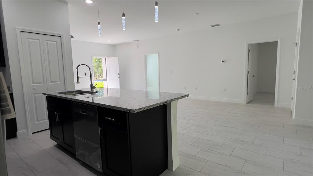 5027 Southwest 165th St Road Ocala, FL 34473 - Photo 16 of 33 a kitchen with a sink and cabinets