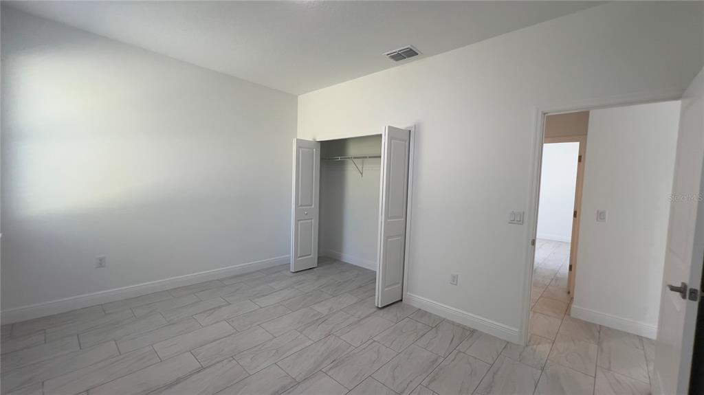 5027 Southwest 165th St Road Ocala, FL 34473 - Photo 18 of 33 a view of an empty room