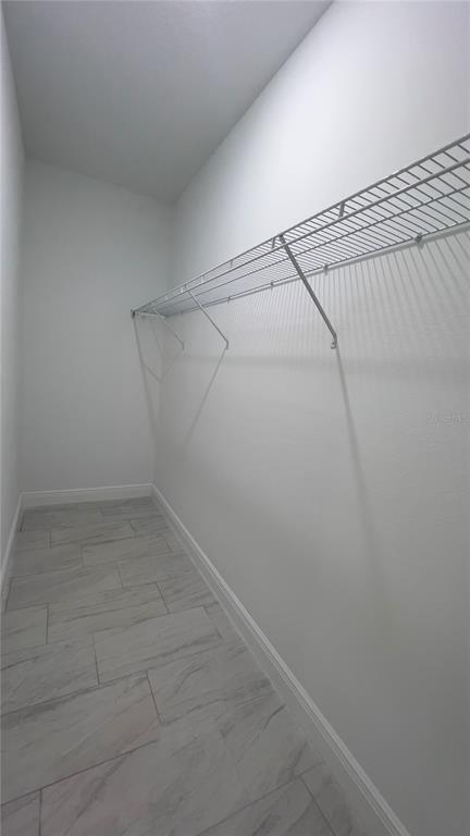 5027 Southwest 165th St Road Ocala, FL 34473 - Photo 21 of 33 a view of a room with racks on the wall