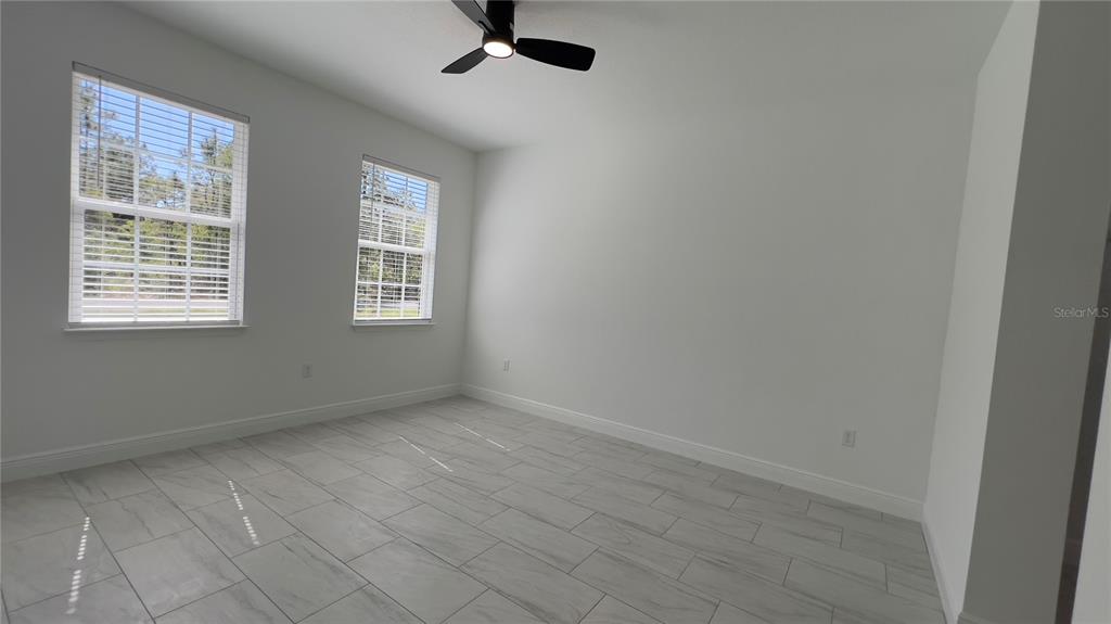 5027 Southwest 165th St Road Ocala, FL 34473 - Photo 27 of 33 an empty room with a window