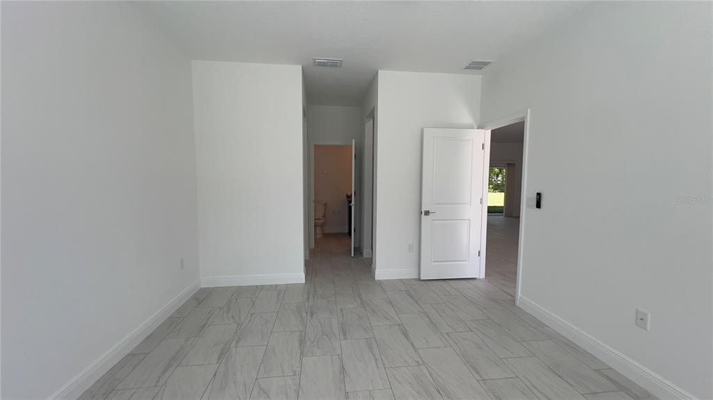 5027 Southwest 165th St Road Ocala, FL 34473 - Photo 28 of 33 a view of hallway with wooden floor