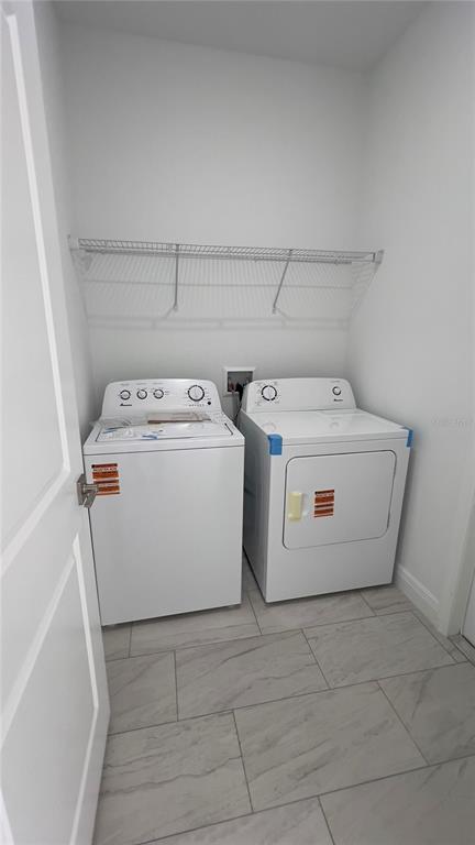 5027 Southwest 165th St Road Ocala, FL 34473 - Photo 32 of 33 a utility room with dryer and washer
