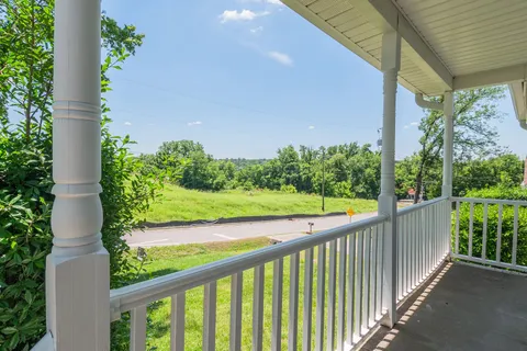 a view of a balcony with an outdoor space