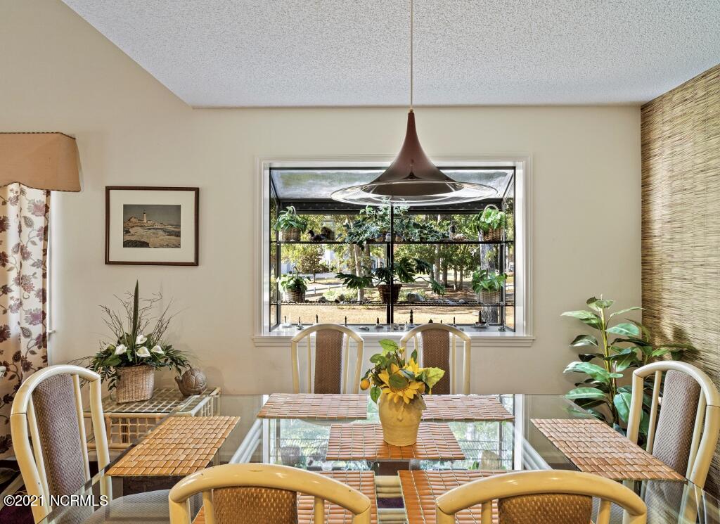 250 Clubhouse Road, Unit A Sunset Beach, NC 28468 - Photo 11 of 32 Dining Area
