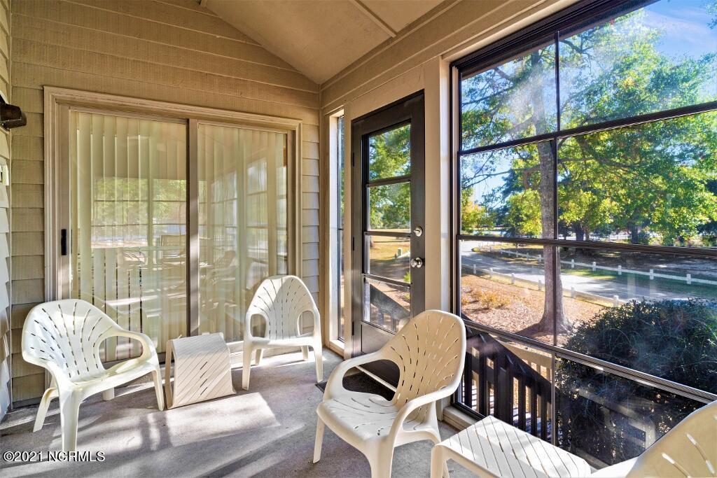 250 Clubhouse Road, Unit A Sunset Beach, NC 28468 - Photo 22 of 32 Screened Porch