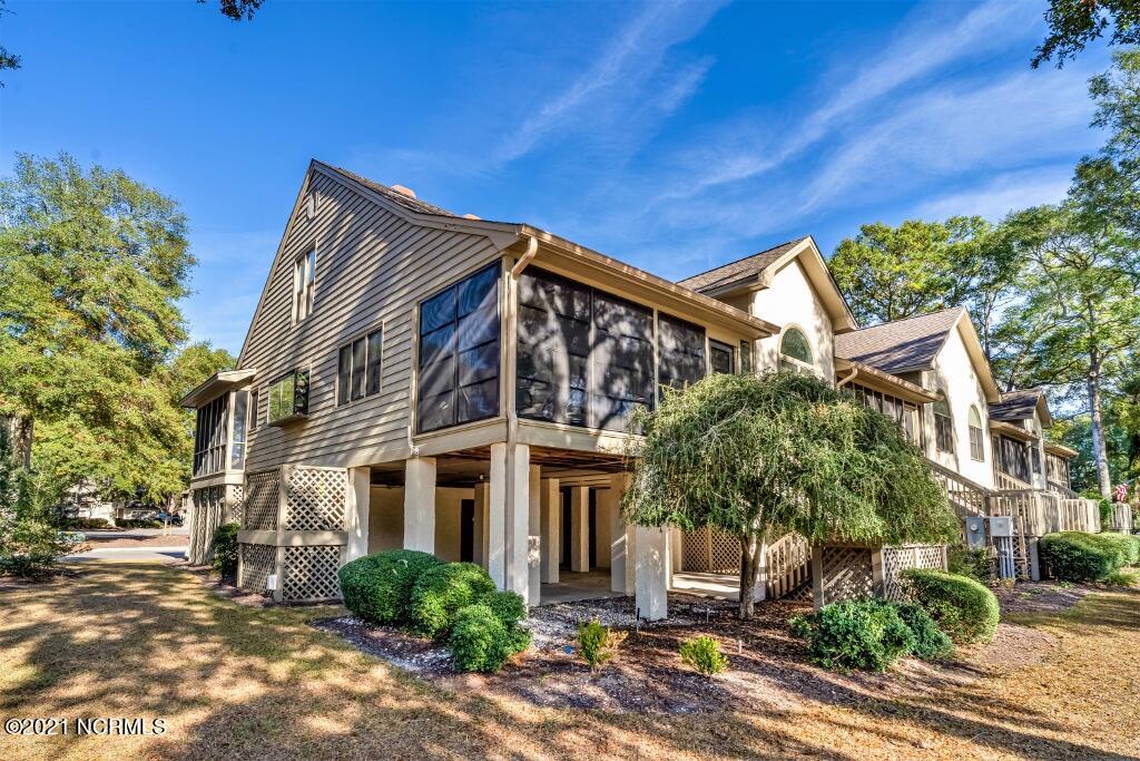 250 Clubhouse Road, Unit A Sunset Beach, NC 28468 - Photo 4 of 32 Side View