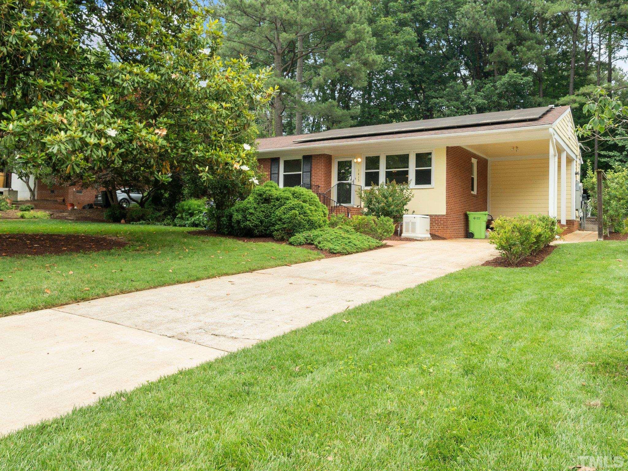 1413 Ashburton Road Raleigh, NC 27606 - Photo 1 of 27 a house view with a garden space