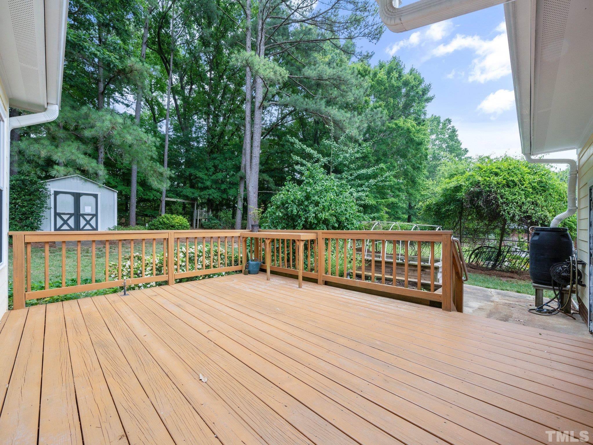 1413 Ashburton Road Raleigh, NC 27606 - Photo 18 of 27 a view of deck with wooden floor and outdoor seating