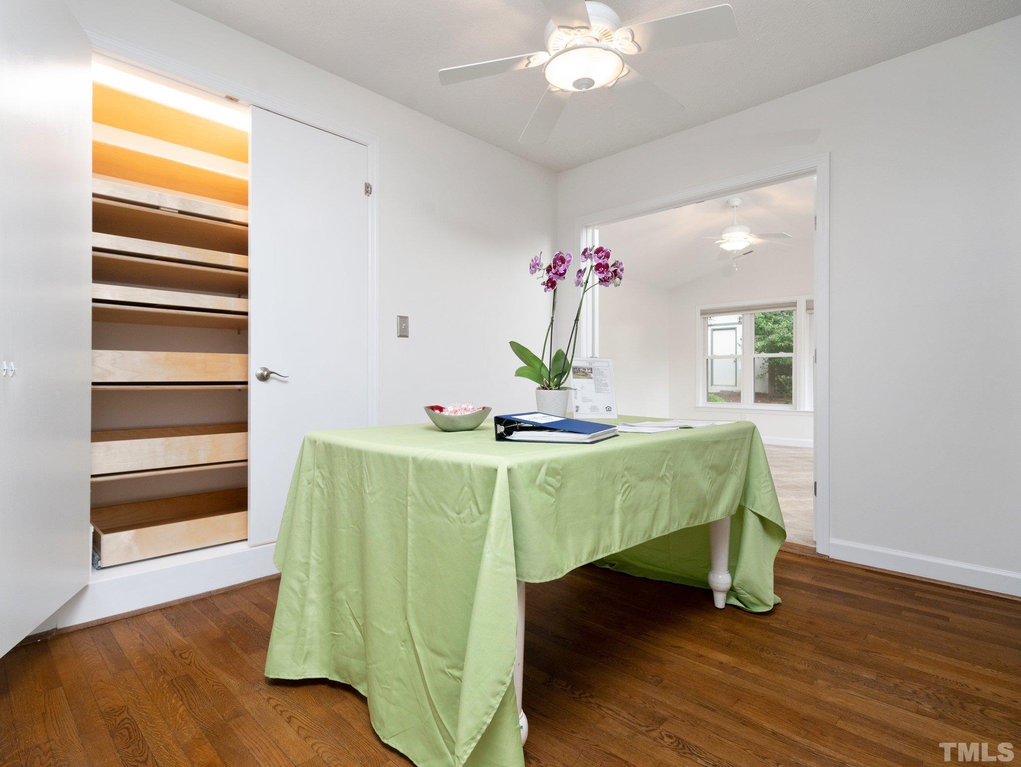 1413 Ashburton Road Raleigh, NC 27606 - Photo 10 of 27 a living room with furniture and a wooden floor