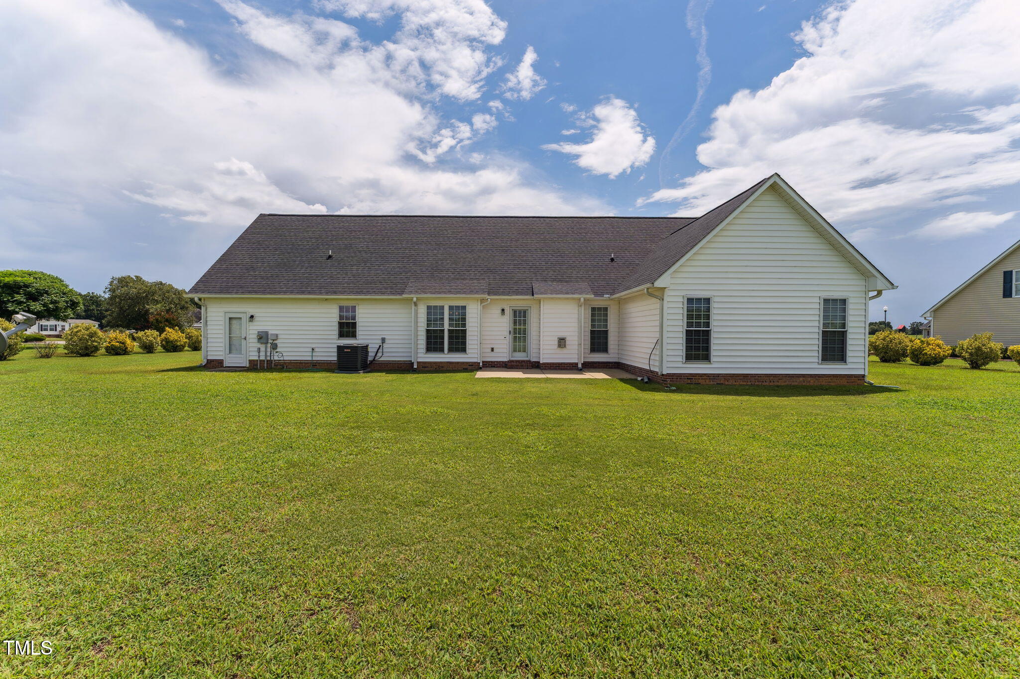 52 Hunters Ridge Trial Dunn, NC 28334 - Photo 6 of 33 a front view of house with an outdoor space and seating