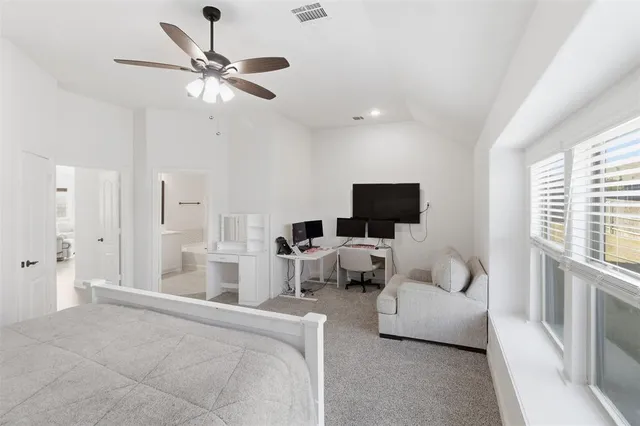 a bathroom with a bathtub a sink and a mirror