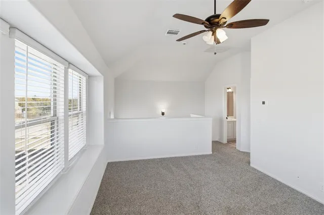 a view of a livingroom with a ceiling fan