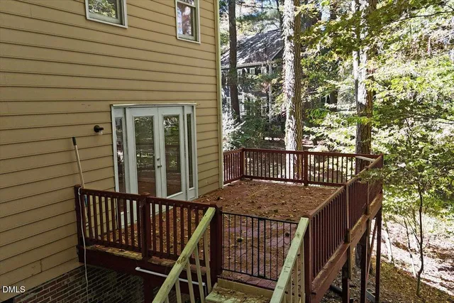 a view of balcony with deck and wooden floor