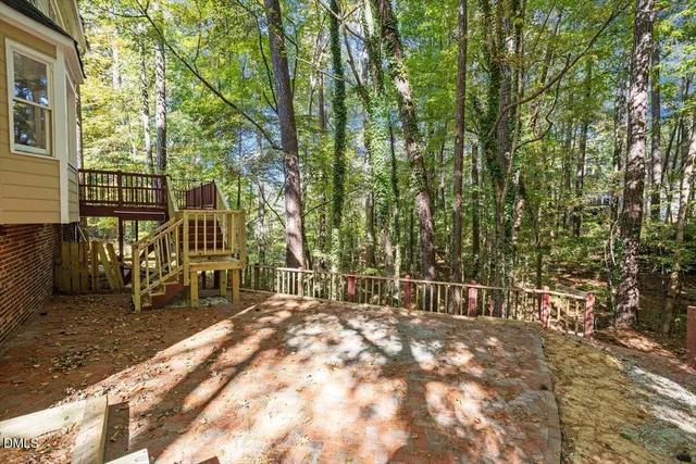 a view of house with backyard