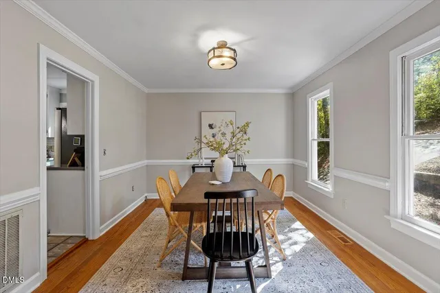 a view of a dining room with furniture window and wooden floor