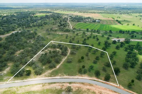 a view of a yard from a balcony