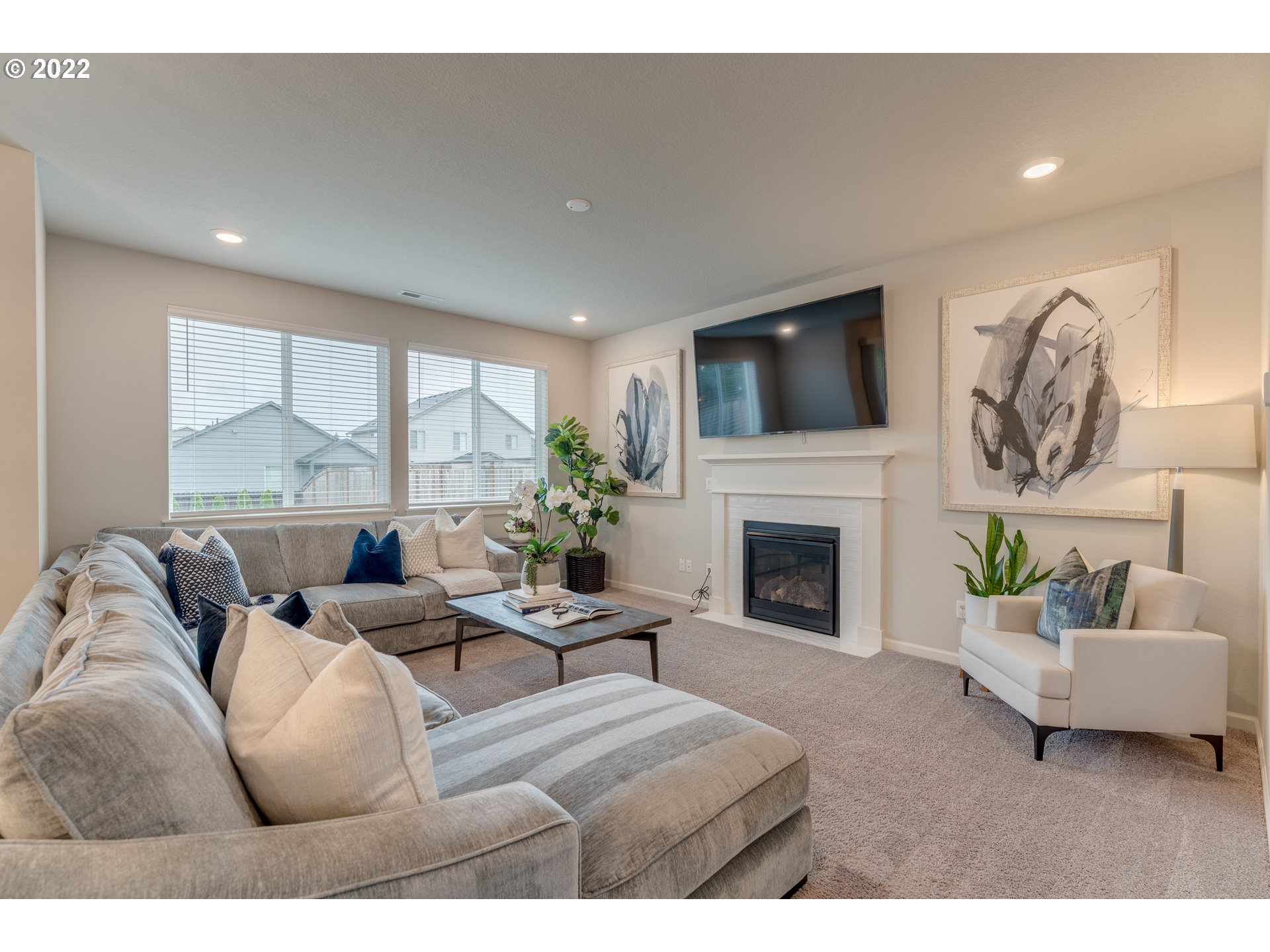 13305 Northeast 114th Way Brush Prairie, WA 98606 - Photo 11 of 31 a living room with furniture a fireplace and a flat screen tv