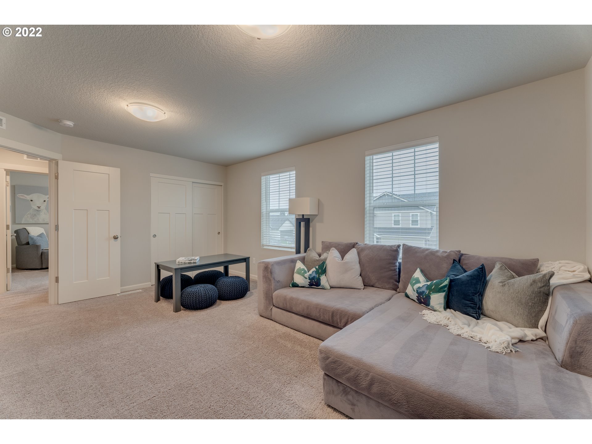 13305 Northeast 114th Way Brush Prairie, WA 98606 - Photo 17 of 31 a living room with furniture and a large window