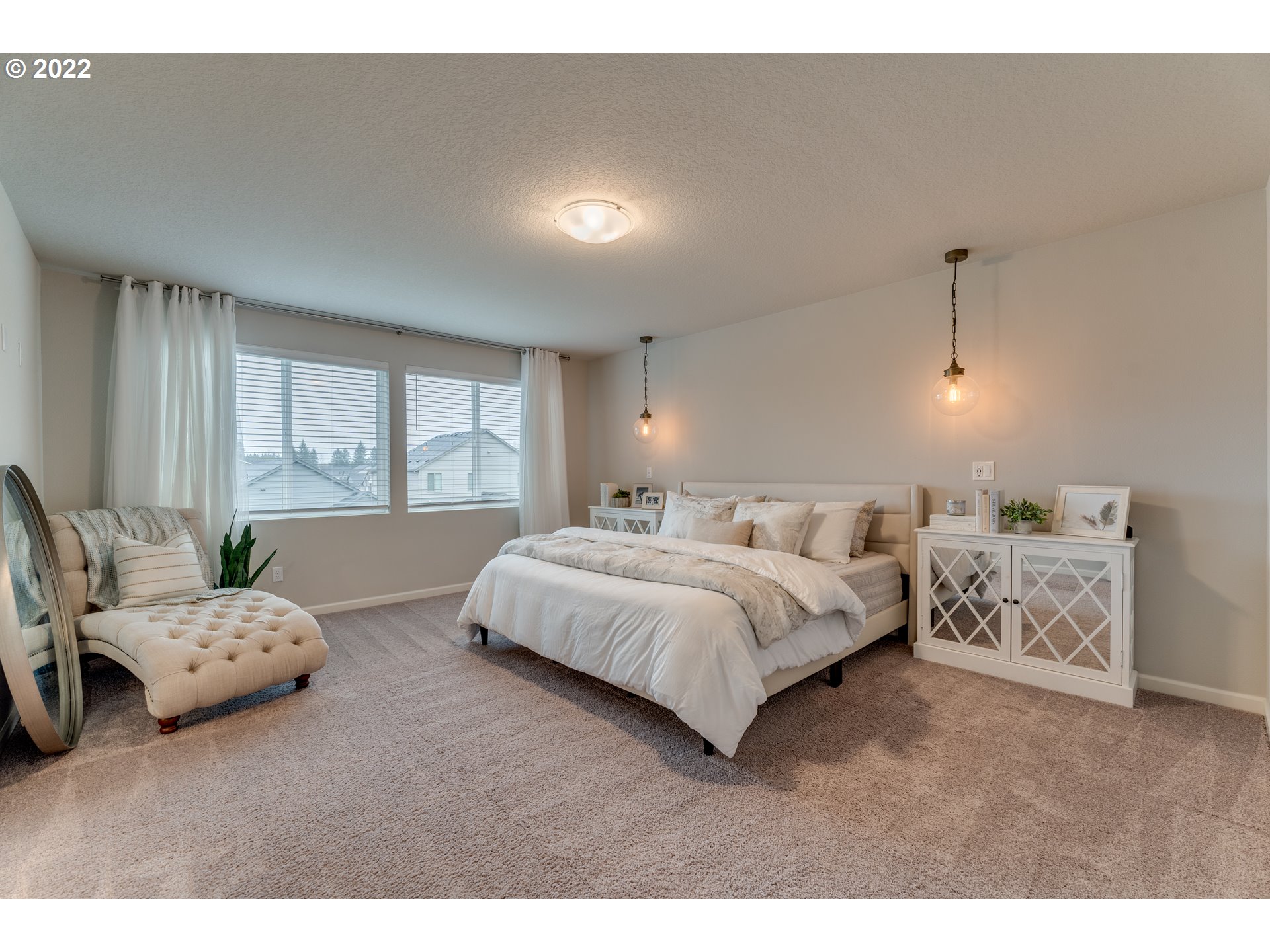 13305 Northeast 114th Way Brush Prairie, WA 98606 - Photo 19 of 31 a spacious bedroom with a bed and large window