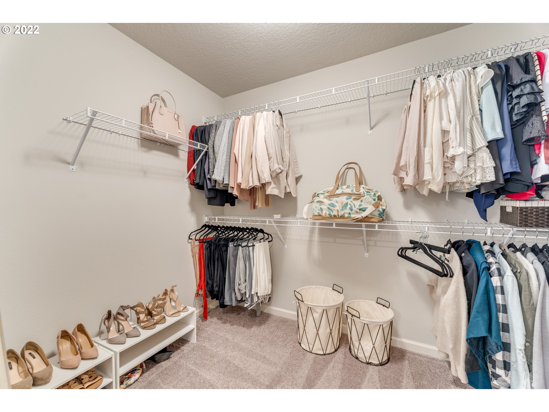 13305 Northeast 114th Way Brush Prairie, WA 98606 - Photo 22 of 31 a view of walk in closet with clothes and shoes