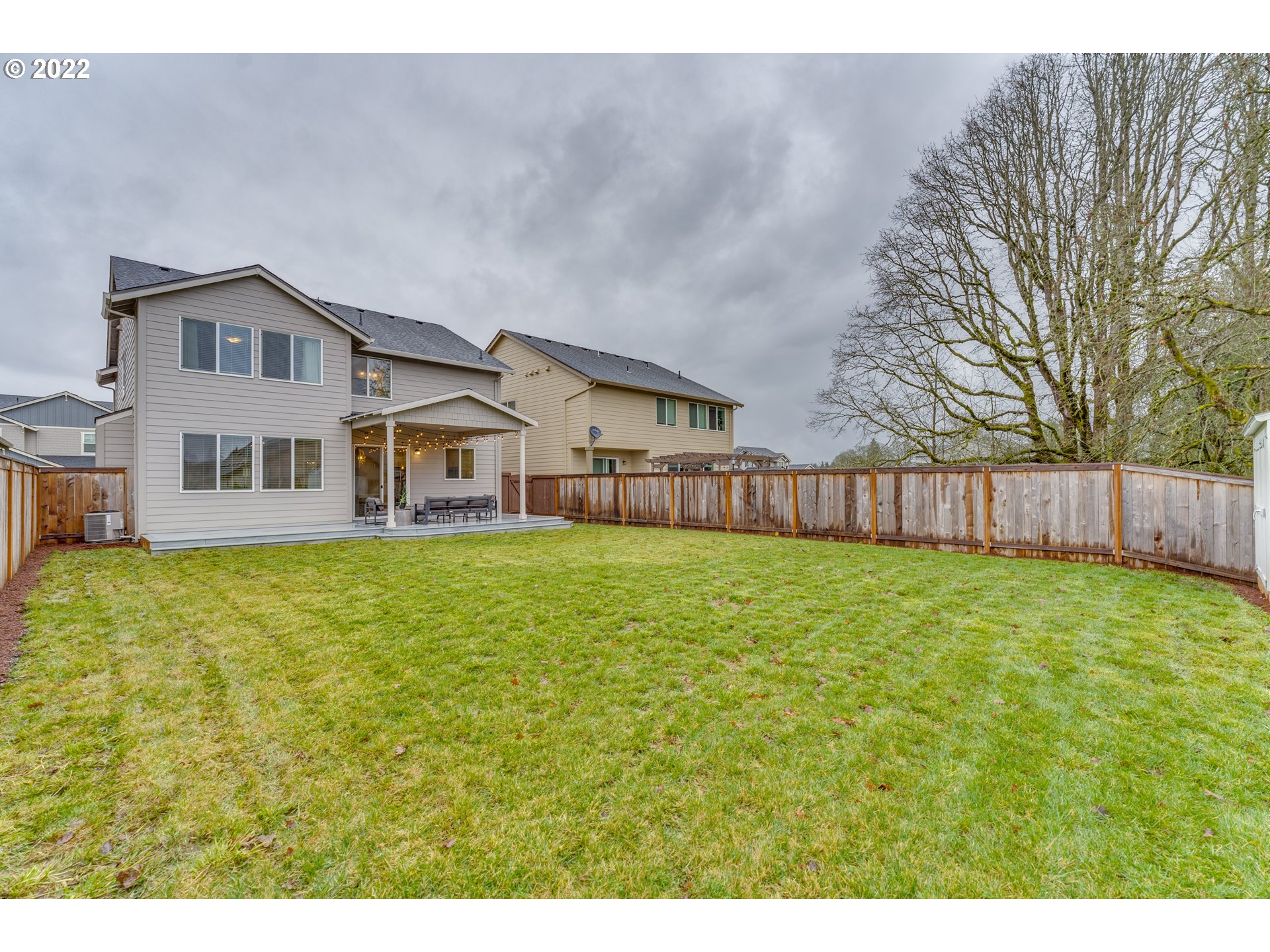 13305 Northeast 114th Way Brush Prairie, WA 98606 - Photo 30 of 31 a front view of a house with a garden